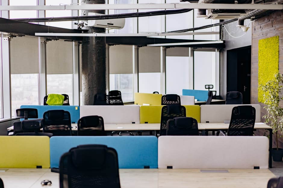 A contemporary office with gaming gear and bright decor.