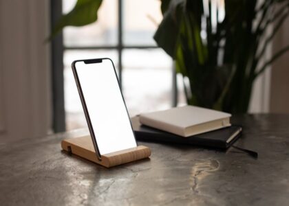 A smartphone on a minimalist desk with soft natural lighting.