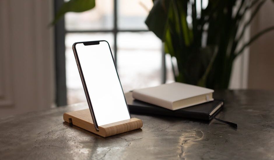 A smartphone on a minimalist desk with soft natural lighting.