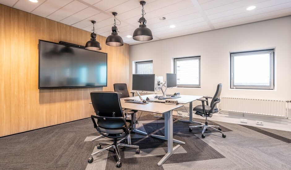 A modern dealership office with digital screens and sleek furniture.