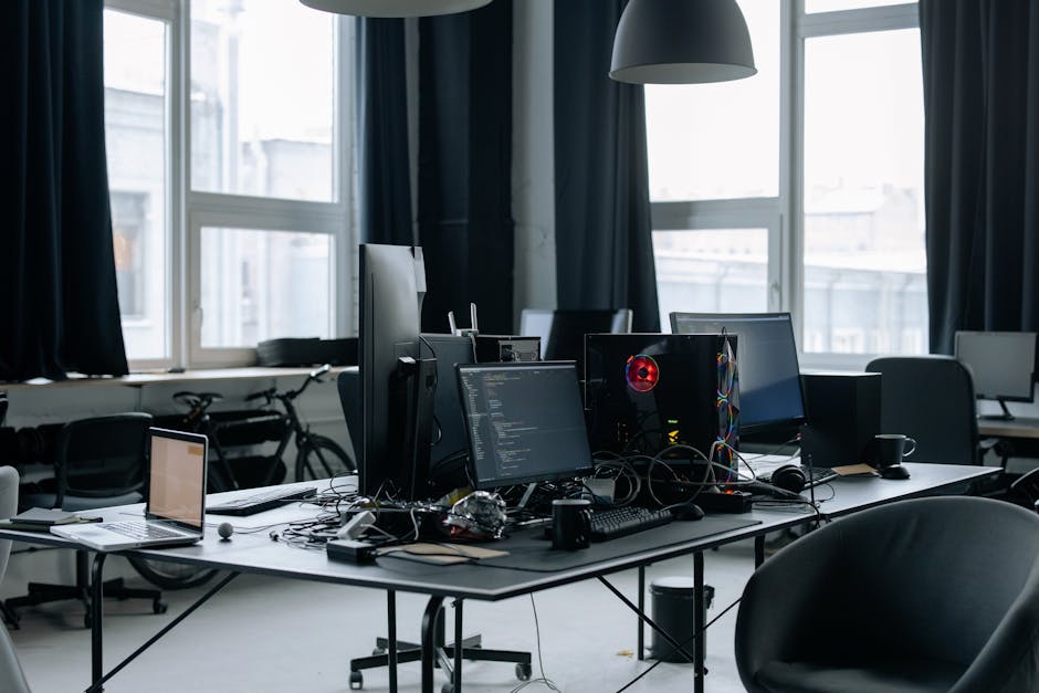 A modern workspace with a laptop and blockchain-themed decor.