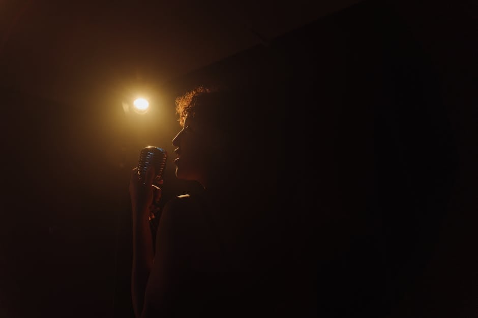 A vintage stage setup with microphones and musical notes in soft light.