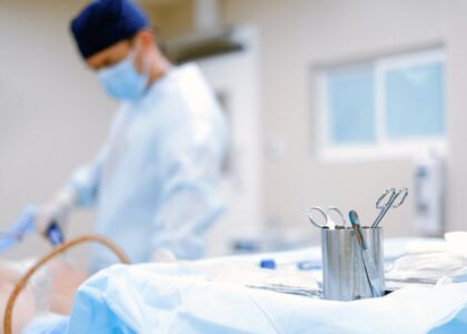 A modern surgical room with tools and equipment, softly lit.