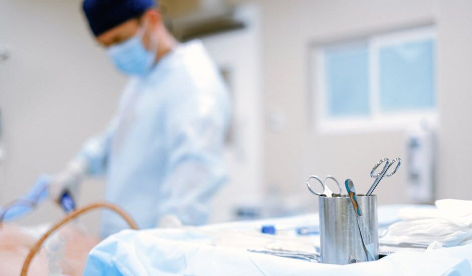 A modern surgical room with tools and equipment, softly lit.