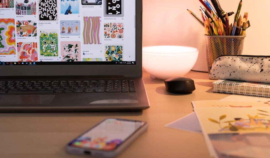 A bright workspace with design tools and colorful graphics displayed