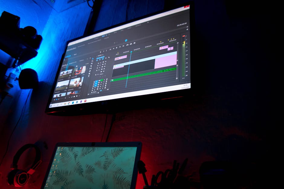 Modern workspace with a computer displaying video editing software.