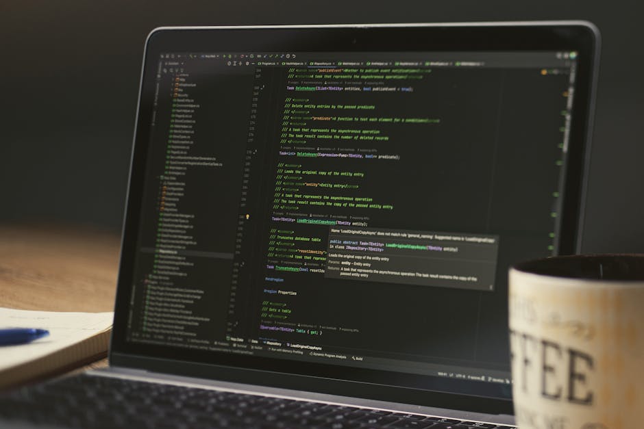 A cozy workspace with a computer screen showing code and a coffee cup.