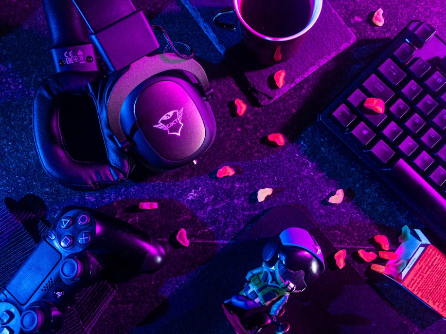 A colorful gaming setup with consoles and LED lights in soft focus.