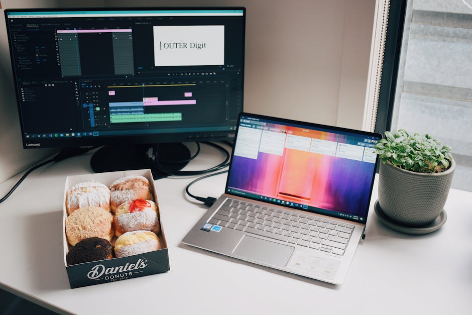 A bright workspace featuring a laptop, sticky notes, and coffee cup