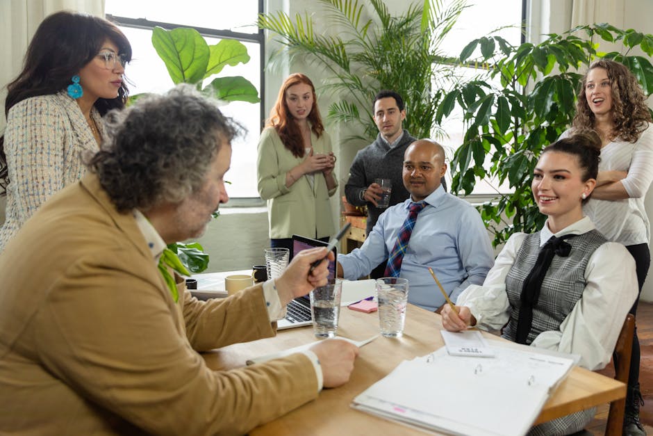 A diverse team collaborating in a bright, inviting office space.