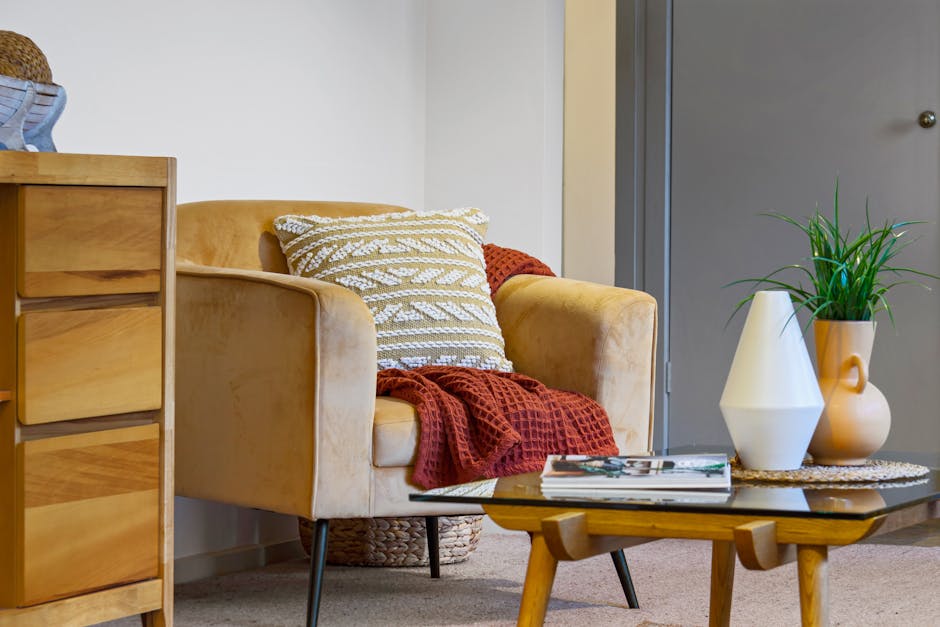 A cozy living room with an armchair and warm lighting.