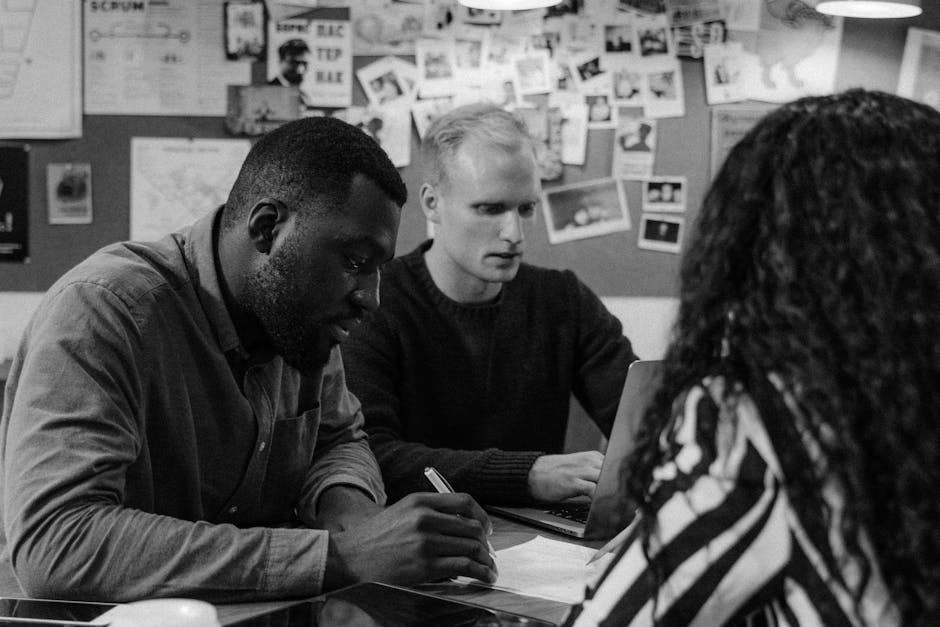 A collaborative office environment with diverse team members working together.