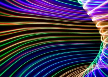 A vibrant digital landscape with glowing orbs and abstract shapes.