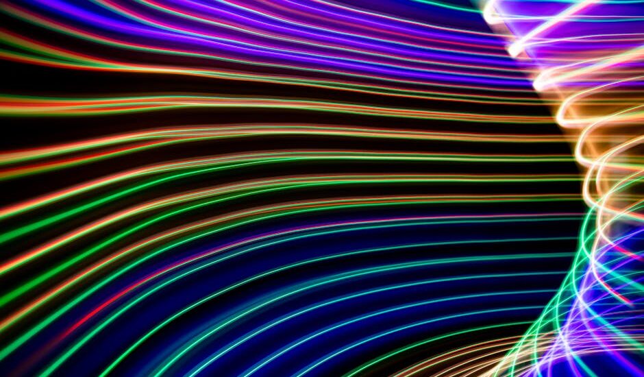 A vibrant digital landscape with glowing orbs and abstract shapes.