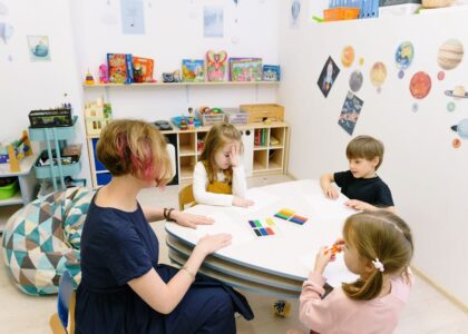 A colorful classroom setup with gaming elements and educational tools.