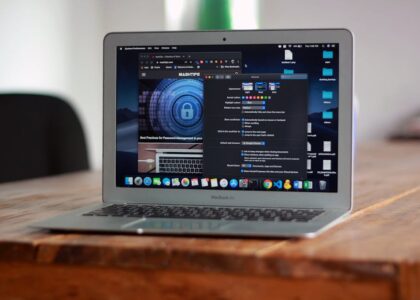 Chromebook displaying a blurred online arena game with safety symbols