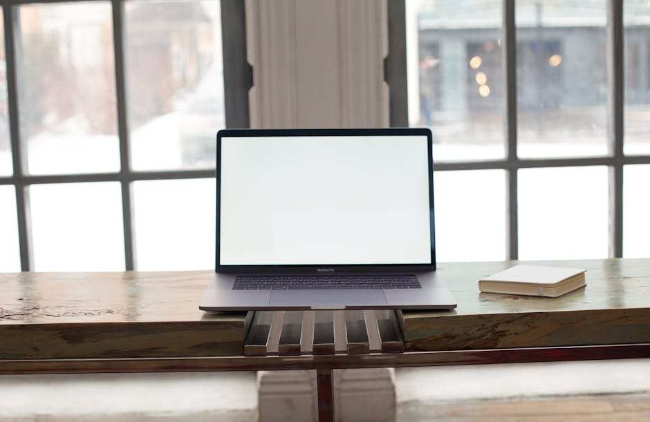 A tranquil workspace with a laptop and natural light streaming in