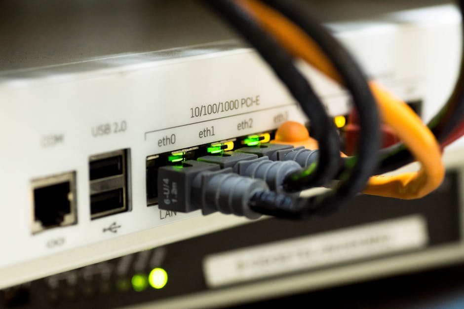 A modern computer setup with network cables and a router.