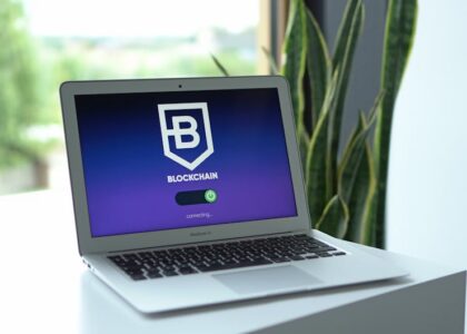Hardware wallet and laptop with glowing blockchain security elements