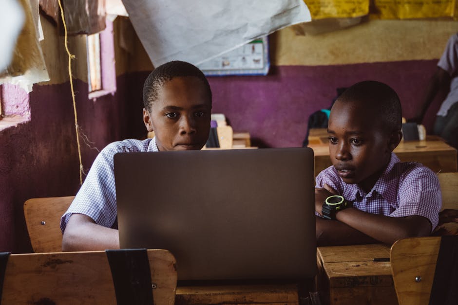 A classroom filled with students playing games on their devices.