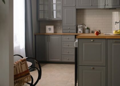 A modern kitchen countertop with innovative cleaning tools and soft lighting.